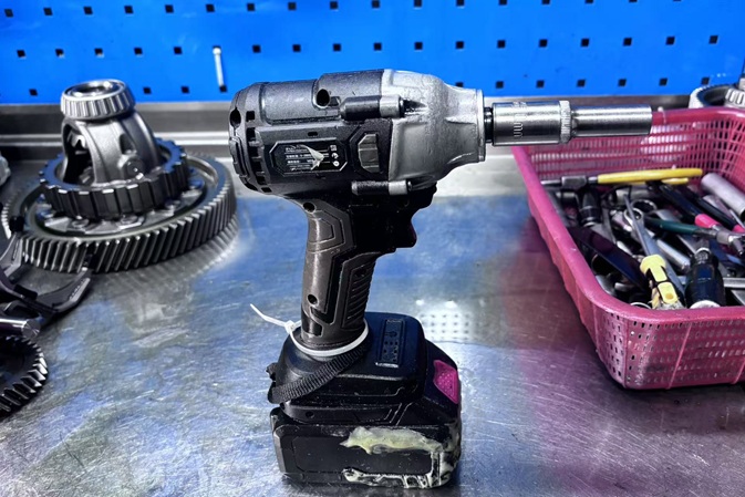 Transmission nameplate, hand tools and a code being read at the bench